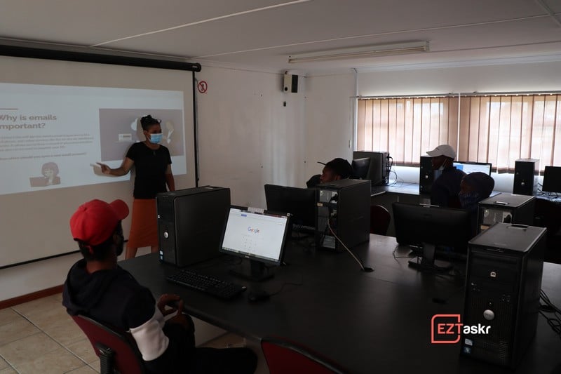 Adult community members practicing their skills on computers